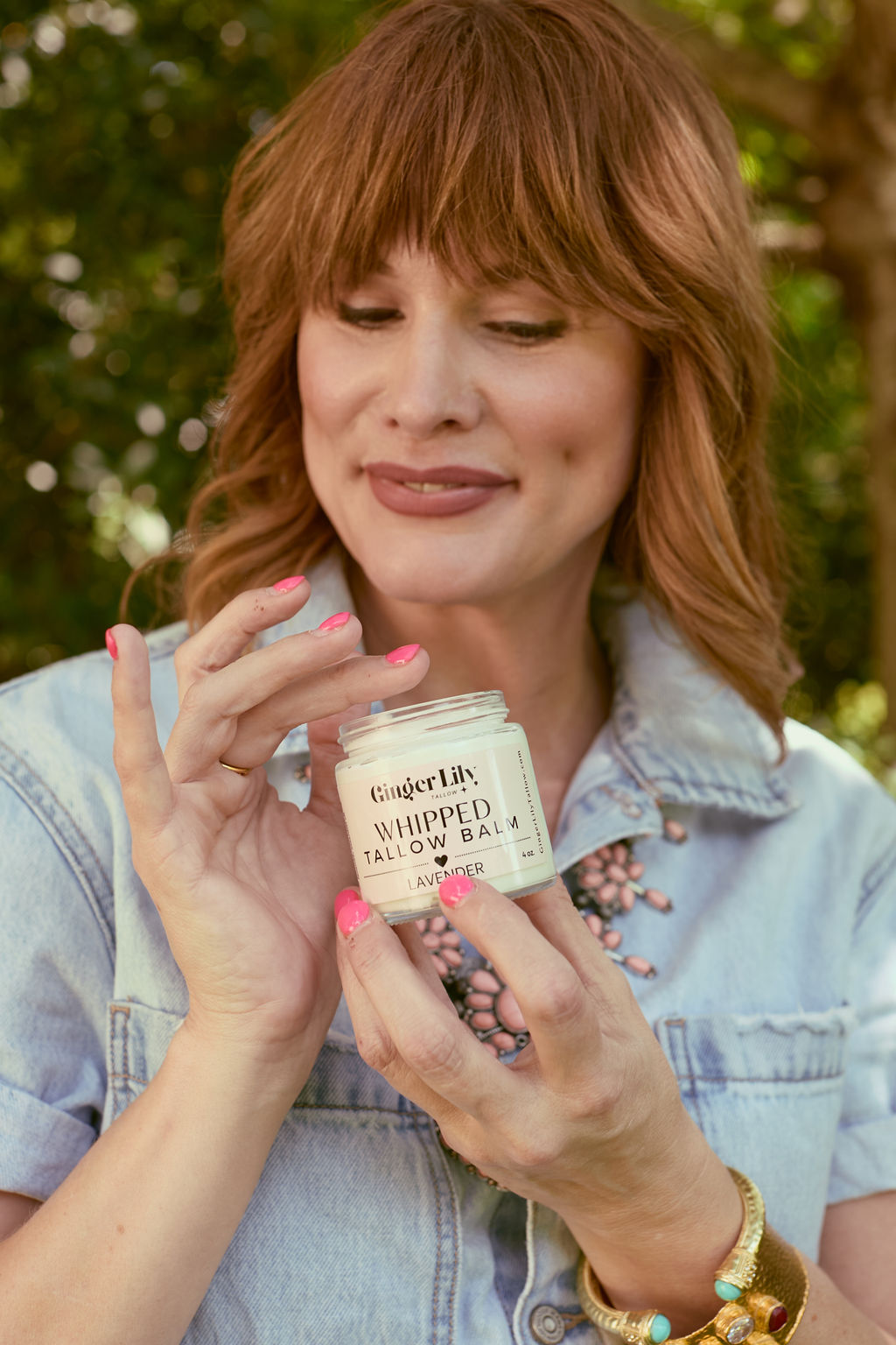 Woman using Ginger Lily Tallow Whipped Tallow Balm for face or body