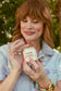 Woman using Ginger Lily Tallow Whipped Tallow Balm for face or body