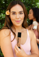 Woman holding beef tallow tinted moisturizer